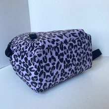 Load image into Gallery viewer, Purple cosmetic bag with black leopard print pattern on a white surface.