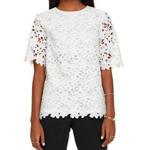 Load image into Gallery viewer, White lace top worn by a person on a white background