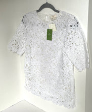Load image into Gallery viewer, White lace top on a hanger with a visible tag against a white background