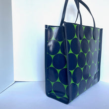 Load image into Gallery viewer, Black tote bag with green circular pattern on a white background