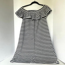 Load image into Gallery viewer, Black and white striped dress on a hanger against a white background