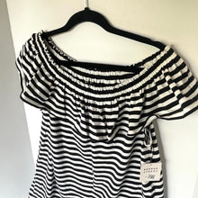 Load image into Gallery viewer, Black and white striped top on a mannequin with a tag, against a plain background