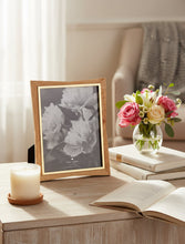 Load image into Gallery viewer, Wooden picture frame with a floral photo on a white background