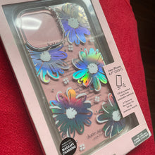 Load image into Gallery viewer, Holographic flower phone case in packaging on a red surface