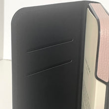 Load image into Gallery viewer, Close-up of a black and beige product with 'Bentley' branding on a light background