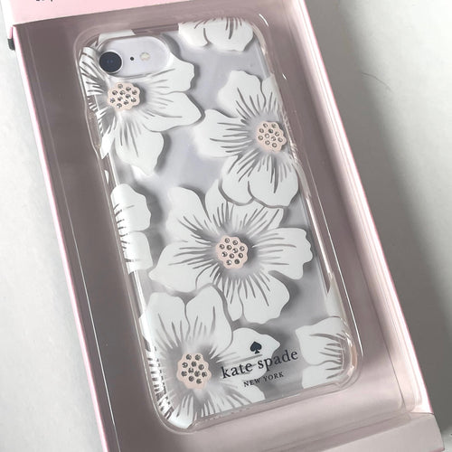 Phone case with floral design and 'kate spade New York' branding in packaging.