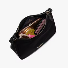 Load image into Gallery viewer, Black handbag with sunglasses and a pink item on a white background