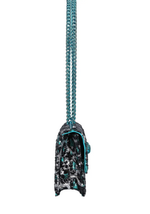 The Small Shoreditch Cross Body from Kurt Geiger London is crafted with leopard print made from sequins. The front flap is topped with teal Eagle head with all over feather detail and green crystal eyes