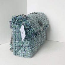Load image into Gallery viewer, Multicolored textured handbag on a white surface with a white background