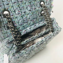 Load image into Gallery viewer, Textured handbag with chain detail on a light background