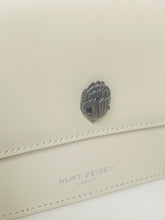 Load image into Gallery viewer, Beige wallet with a decorative emblem and 'Kurt Geiger London' branding.