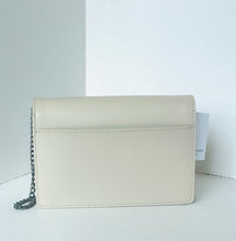 Load image into Gallery viewer, Beige handbag with a chain detail on a white background
