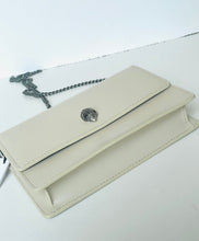 Load image into Gallery viewer, Beige handbag with a chain detail on a white background