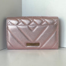 Load image into Gallery viewer, Pink quilted clutch bag with brand logo on a white surface