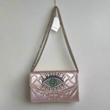 Load image into Gallery viewer, Metallic pink handbag with eye design and chain strap on a white background
