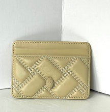 Load image into Gallery viewer, A beige quilted leather card holder with a central embossed logo and decorative stitching, photographed against a white background.
