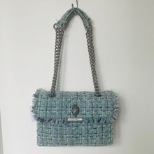 Load image into Gallery viewer, Blue textured handbag with chain handle on a white background