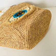 Load image into Gallery viewer, Woven straw bag with decorative elements on a white background