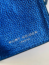 Load image into Gallery viewer, Close-up of a blue textured leather product with silver-toned 'KURT GEICER LONDON' branding on a white background.