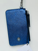 Load image into Gallery viewer, A blue pebbled leather zip-around card holder wallet with a silver-tone lion emblem, a black tassel zipper pull, and a metal clip, shown with a paper tag against a plain white background.