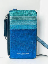 Load image into Gallery viewer, A Kurt Geiger London metallic pebbled leather wallet in a blue gradient design, featuring a vertical stripe pattern in teal, light blue, and royal blue, with a matching blue wristlet strap and zipper pull.