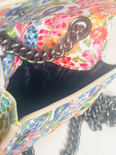 Load image into Gallery viewer, Close-up of a colorful floral-patterned handbag with a chain strap.