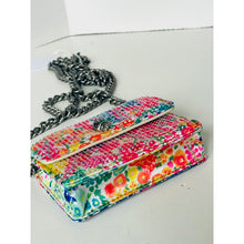 Load image into Gallery viewer, Floral patterned clutch bag with a chain strap on a white surface