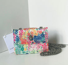 Load image into Gallery viewer, Floral patterned handbag with a chain detail on a light gray background