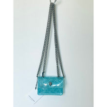 Load image into Gallery viewer, Blue handbag with a chain strap on a light gray background