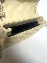 Load image into Gallery viewer, Close-up of a beige handbag with braided handle on a white background