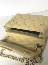 Load image into Gallery viewer, Beige handbag with chain detail on a white background