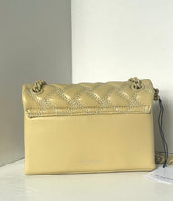 Load image into Gallery viewer, Beige handbag with quilted design on a white surface