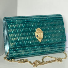Load image into Gallery viewer, Teal handbag with gold chain and decorative clasp on a white background