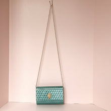 Load image into Gallery viewer, Green textured handbag with a chain strap on a white background
