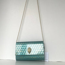 Load image into Gallery viewer, Teal handbag with chain strap on a white background