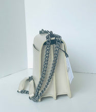 Load image into Gallery viewer, White handbag with a chain detail on a white background