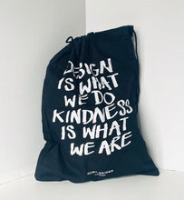 Load image into Gallery viewer, Navy drawstring bag with white text on a light gray background
