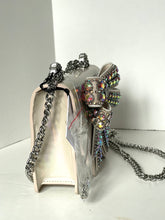 Load image into Gallery viewer, Decorative keychain with a silver design on a white surface