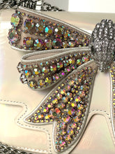 Load image into Gallery viewer, Shoe with a decorative bow made of multicolored rhinestones on a light background