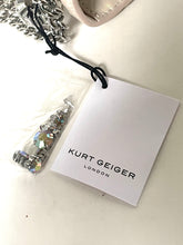 Load image into Gallery viewer, Bracelet with chain and clear stones on a Kurt Geiger London tag.