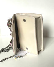 Load image into Gallery viewer, White handbag with decorative chain on a white background