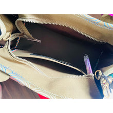 Load image into Gallery viewer, Open beige bag with colorful patterns on a white background