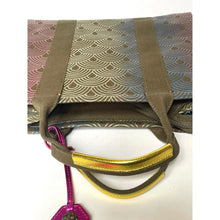 Load image into Gallery viewer, Handbag with geometric pattern and gold accent on a white background