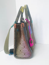 Load image into Gallery viewer, Handbag with geometric pattern and colorful zippers on a white background