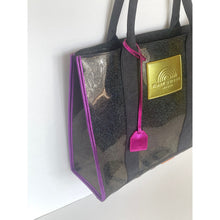 Load image into Gallery viewer, Black tote bag with gold tag and pink strap on a white background