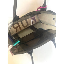 Load image into Gallery viewer, Clear plastic bag with visible branding on a white background