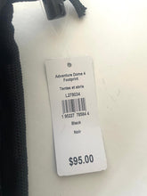 Load image into Gallery viewer, A white retail price tag attached to a black item, showing the text 'Adventure Dome 4 Focprint', 'Taille et abie', 'L278034', 'Black', 'Noir', and '$95.00' on a white surface.