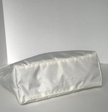 Load image into Gallery viewer, A white satin or silk pillowcase with a subtle sheen, photographed on a plain light gray background.