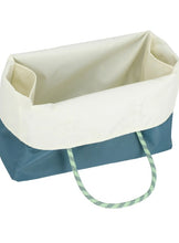 Load image into Gallery viewer, A fabric storage basket with a cream-colored upper lining and a teal blue lower body, featuring green and white patterned rope handles, shown on a white background.