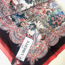 Load image into Gallery viewer, Floral and paisley patterned fabric with a Liberty label on a white background